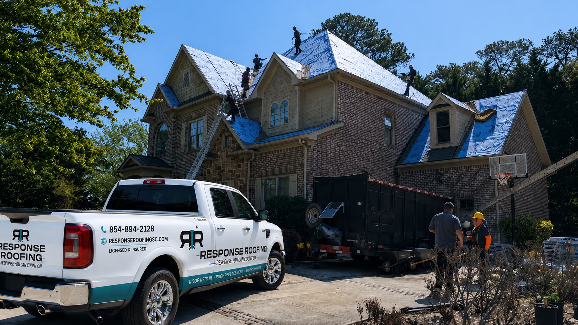 A Response Roofing truck parked at a home while the crew installs new underlayment on the roof.
