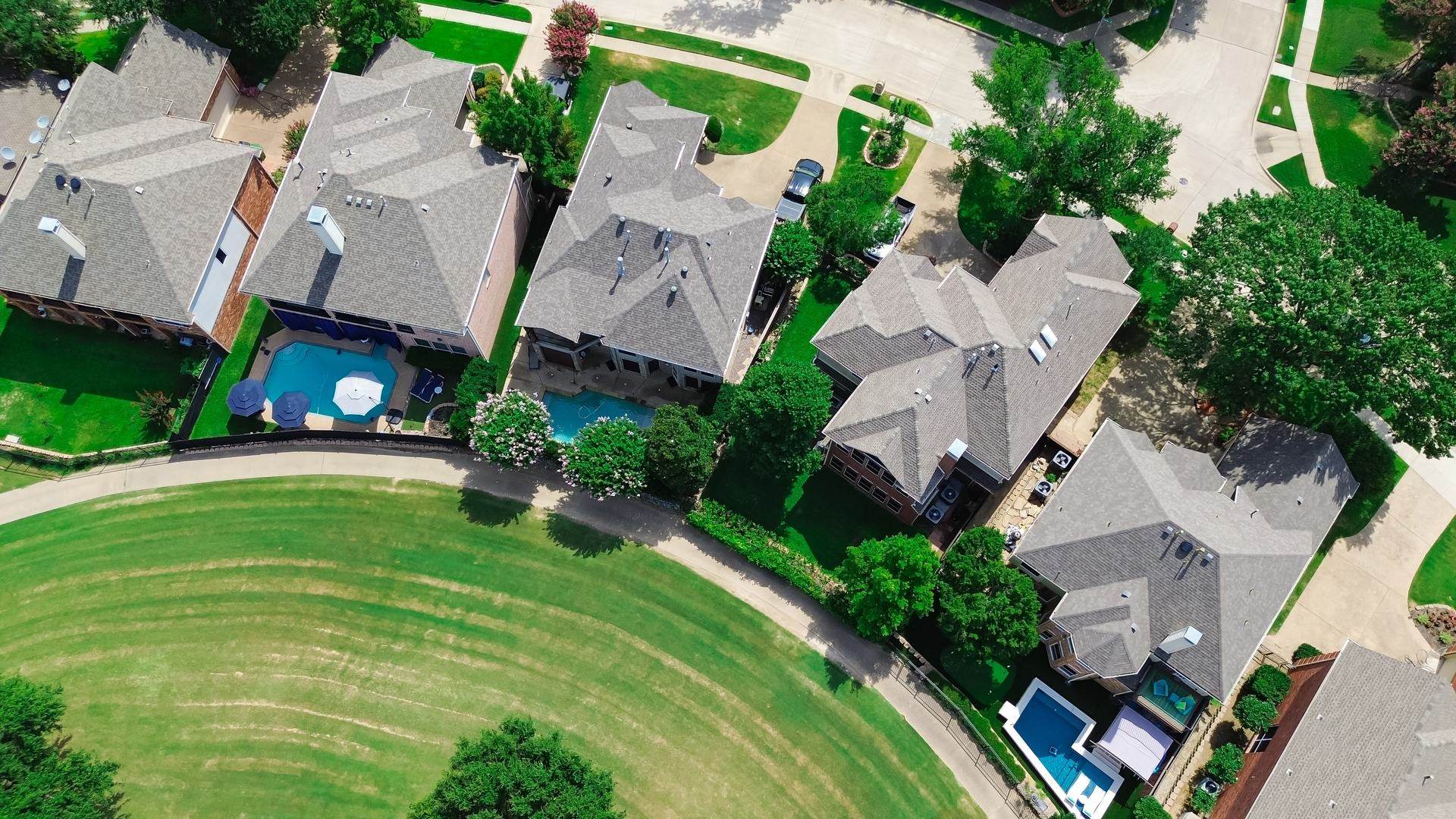 Aerial view of a Grand Strand neighborhood of homes with newly finished shingle roofs.