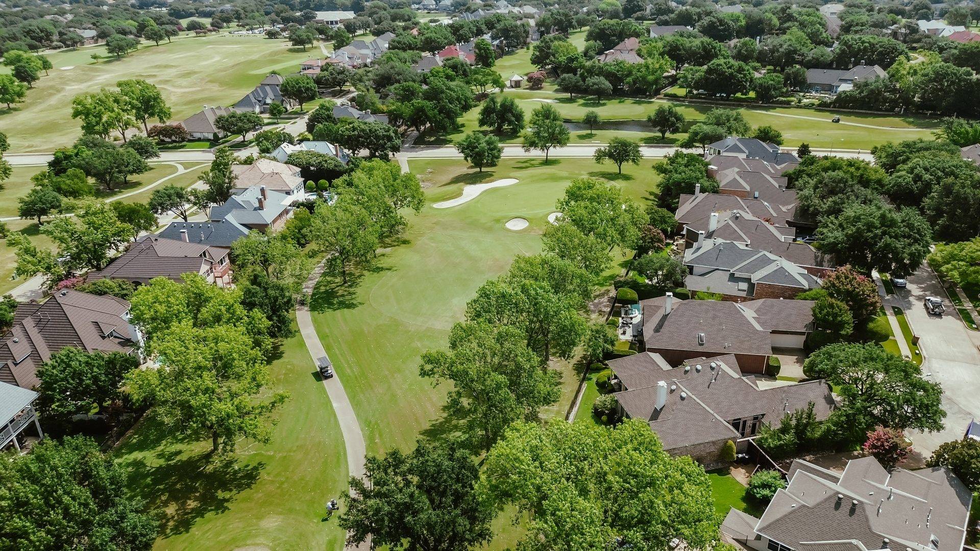 Aerial view of a South Carolina neighborhood of shingle-roofed homes.