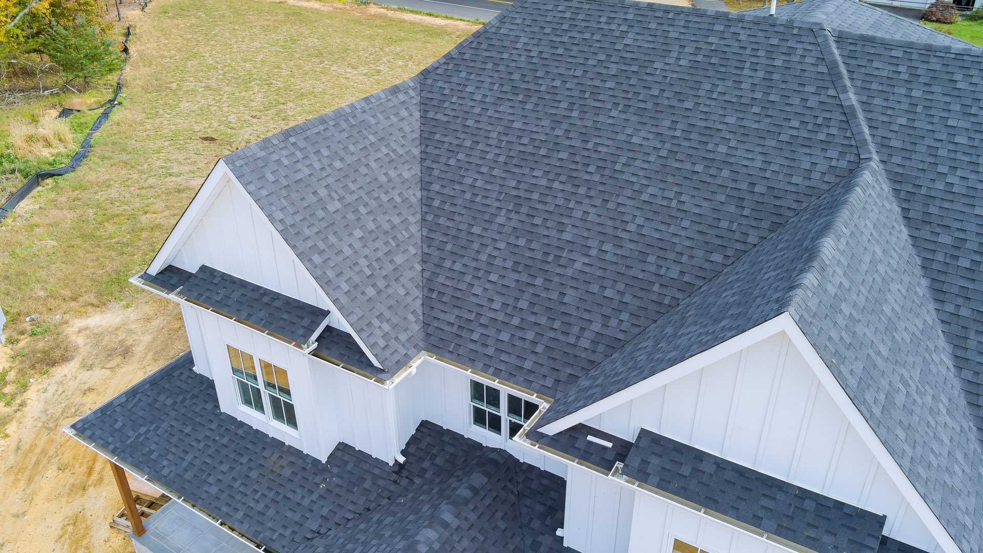 Aerial view of a newly completed gray shingle roof on a South Carolina home.